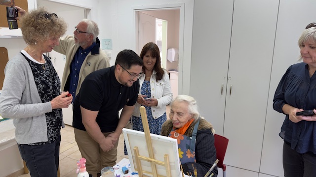 Karen and Joshua with a resident of the Haifa Home for Holocaust survivors in the art and crafts room.